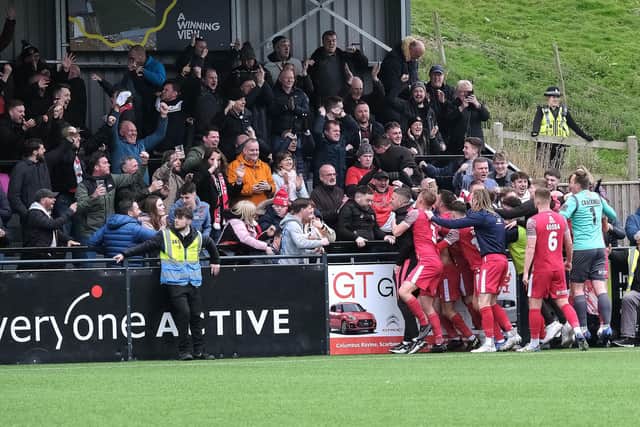 Fans celebrate Boro's late leveller v Banbury.