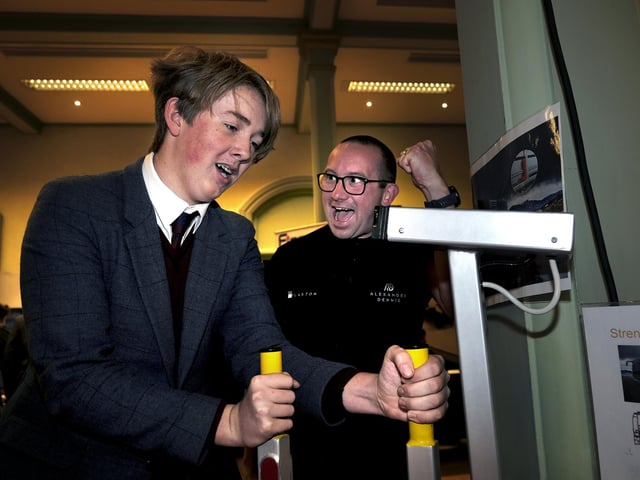 On the Plaxton's Strengthometer with a Scarborough College student and Plaxton's Adam Gosling cheering