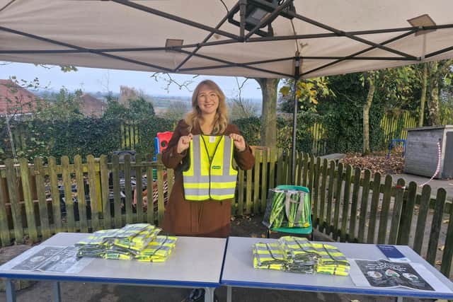 Rachel Patience, Assistant Manager at Specsavers Malton attended Thornton Dale Primary School's firework night to provide pupils with hi-vis jackets and safety information