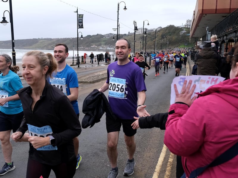High fives for the runners.