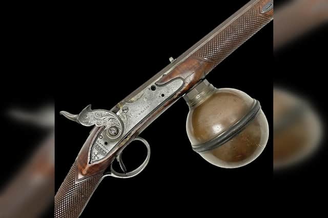 Close up of the air reservoir that had to be removed and pumped up before the rifle was used. Photo courtesy of David Duggleby Auctioneers.