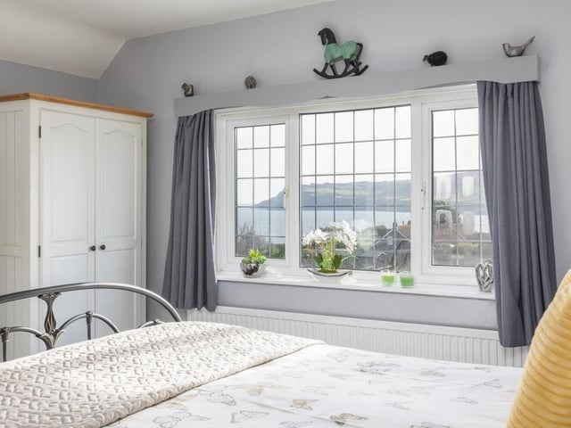 Another bedroom with a beautiful outlook.