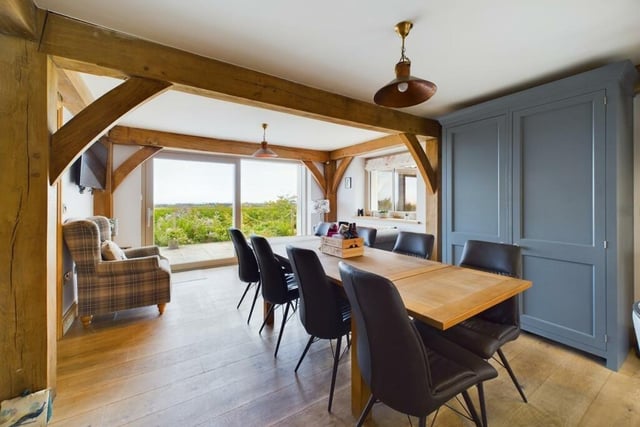 The dining area has doors leading outside to the patio and garden.