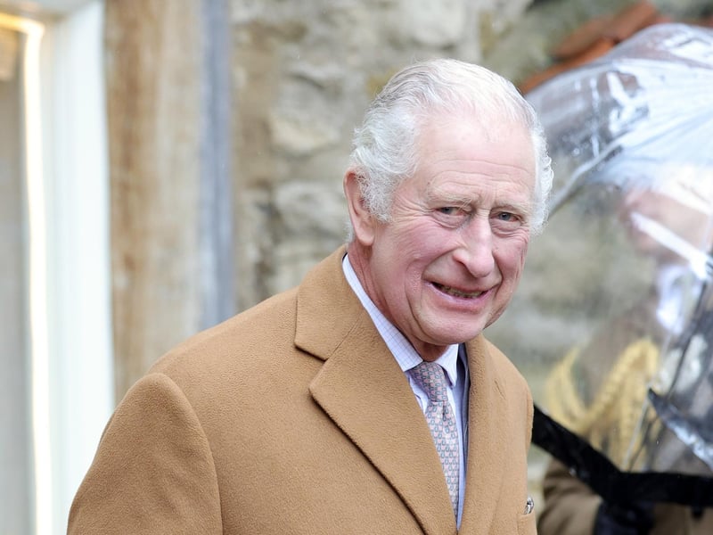 King Charles III also smiles for the camera.