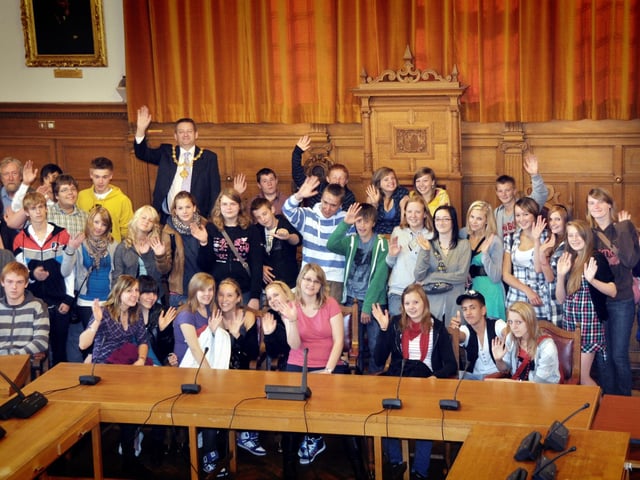 The Mayor of Scarborough and District Cllr Bill Chatt hosted a party of German and George Pindar School students before giving them a tour of the Town Hall. They are pictured in the Council chamber. 0094004