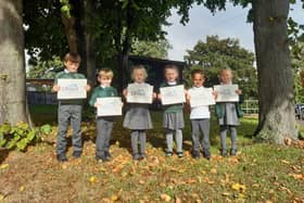 Airy Hill School youngsters celebrate the school's 'Good' Ofsted rating.