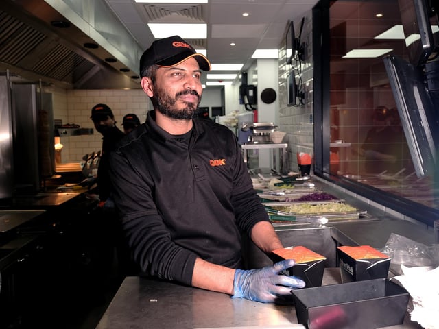 Staff prepare orders.