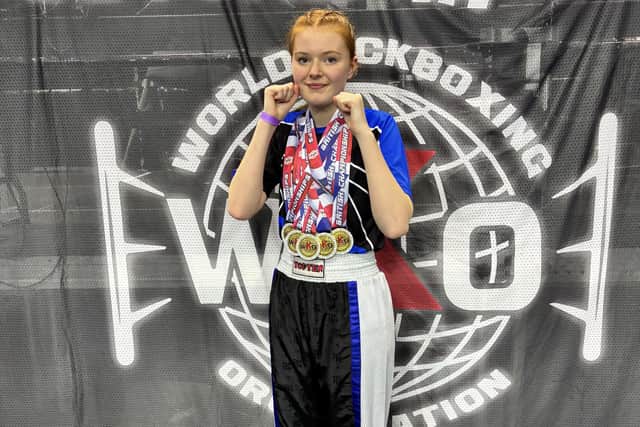 Scarborough's Sarah Dicks shows off her five gold medals from the WKO British Championships.
