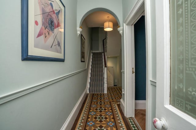 The entrance hallway with traditional tiled flooring.