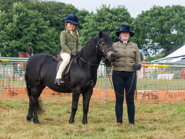 Isabelle Bunyan, of Egton, riding Cayberry Stringfellows, held by her mum Louise Bunyan.