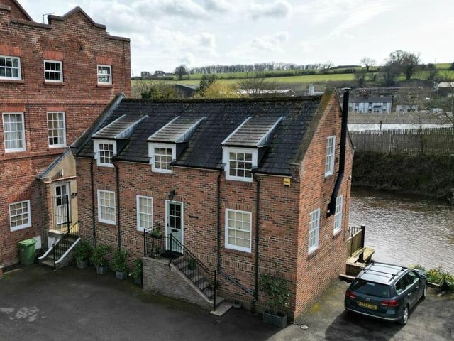 The attractive village home has a great location by the River Esk.