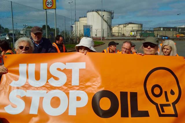 Cllr Theresa Norton, pictured on the right wearing a khaki-coloured hat, at the protest outside the oil terminal. (Photo: Just Stop Oil)