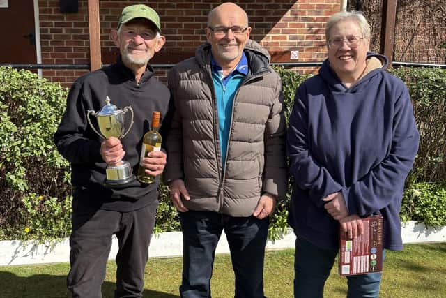 Les Ramm, left, is presented with the Webb Cup by Borough BC president Shaughan Temple, with runner-up Jo Gates looking on.