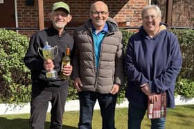 Les Ramm, left, is presented with the Webb Cup by Borough BC president Shaughan Temple, with runner-up Jo Gates looking on.