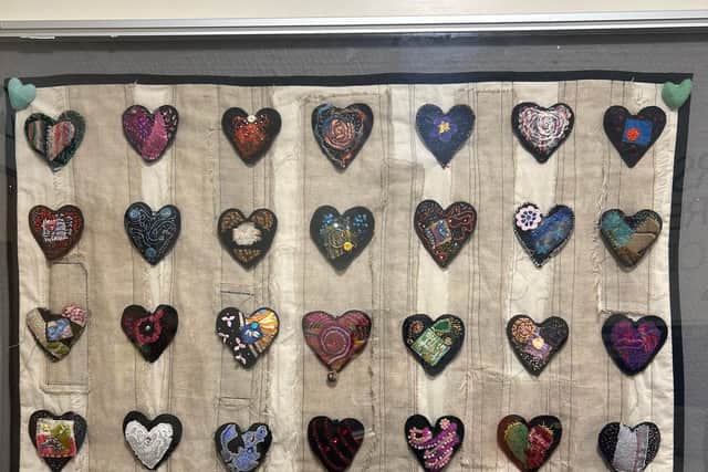 A display of the individual handmade hearts that were donated to Rowan Lea ward.