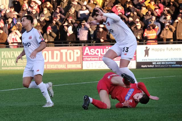 A home player takes a tumble in the National League North match
