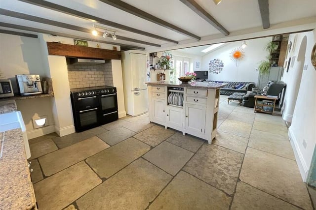 The open plan living and dining kitchen is farmhouse style with a modern twist.