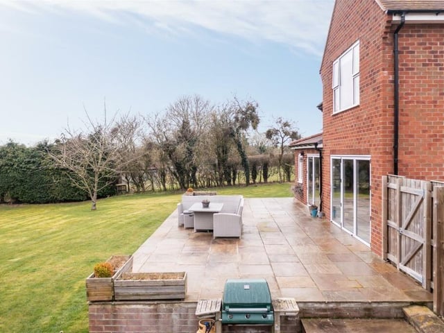 A raised terrace that provides the perfect place for dining outdoors, or for entertaining in summer.