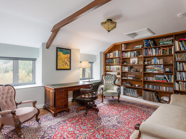 A versatile room ideal for use as a home office, library or bedroom.