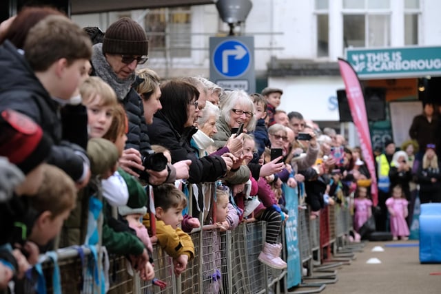 Crowds gather to watch the Pancake Day Races on Aberdeen Walk in Scarborough