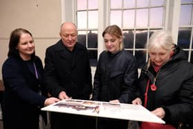 Looking at plans for the Town Hall renovation - L-R - Project officer Kerry Levitt, Cllr Phil Trumper, Dehenna Davison MP and Mayor Linda Wild