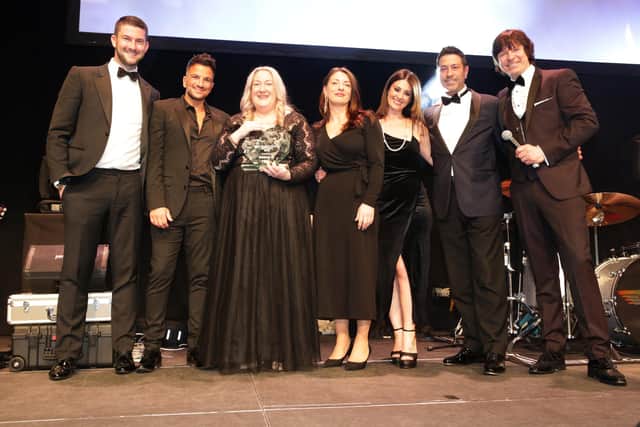 Lynne Taylor winning a national award.