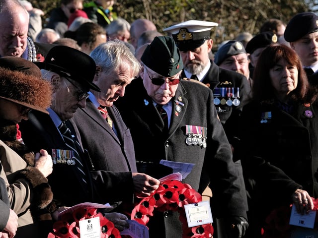 Sir Robert Goodwill prepares to lay his wreath