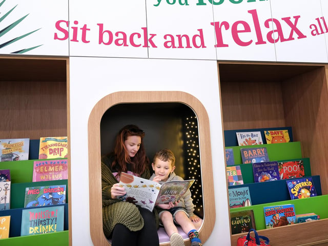 Enjoying a quiet read in the children's area.