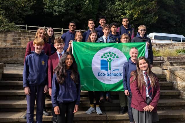 Fyling Hall School pupils with the Eco-Schools' Green Flag.