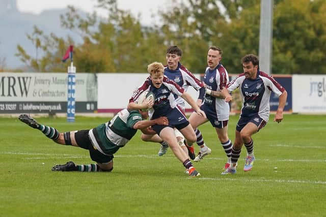 York try to halt Ollie Carroll's progress. Photo by Charlie Hopper