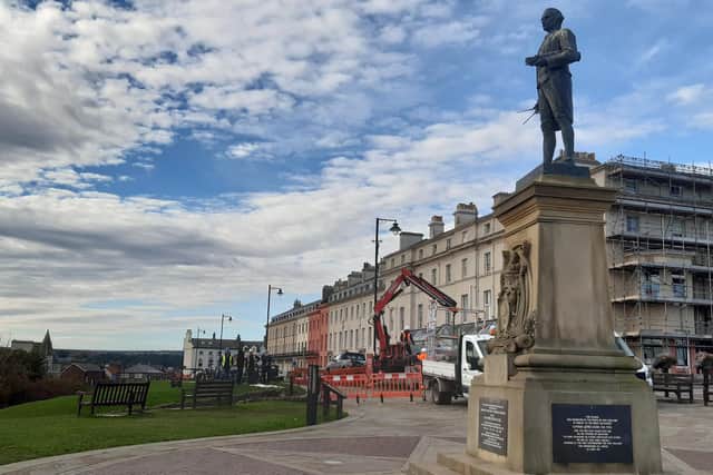 Captain Cook look at the new, temporarym, bones-less view on Whitby's West Cliff.