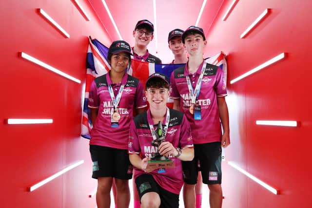 Members of the SBA Unity Racing team celebrate their win