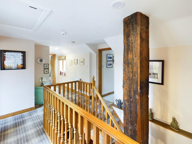 The landing area with built in storage leads to four bedrooms and the family bathroom.