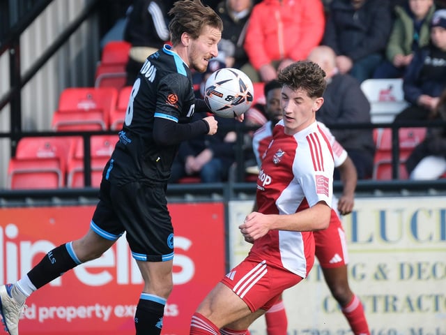Scarborough Athletic defender Mackenzie Maltby gets stuck in against Chester.