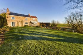 The house has extensive land and gardens, with views that stretch for miles.