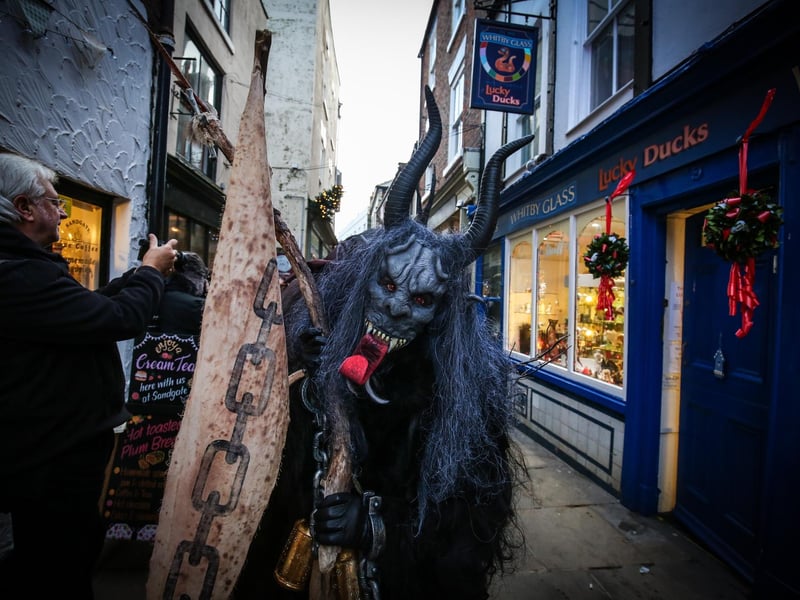 One of the Krampus critters poses for a pic on Sandgate.
Picture: Ceri Oakes