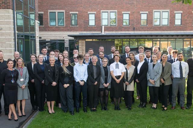 The 33 new police officers pictured with their trainers, Chief Constable Lisa Winward and Magistrate Sarah Bailey.