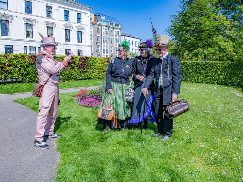 Visitors to the Steampunk Weekend in Filey pose for pictures.