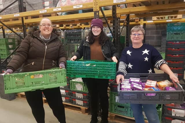 Katrina, Elinor and June (left to right) pictured at the East Yorkshire Foodbank warehouse sorting food to be put into parcels. Credit: EYFB/Mandy Thomlinson