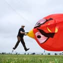 Andy Clayton sets his Angry Bird kite into the sky. All photos by Richard Ponter.