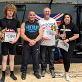 Powerlifters, from left,