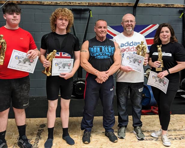 Powerlifters, from left,