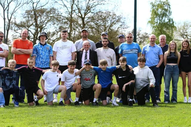 George Ireland, centre, lines up with current Valley players. PHOTO: ZACH FORSTER