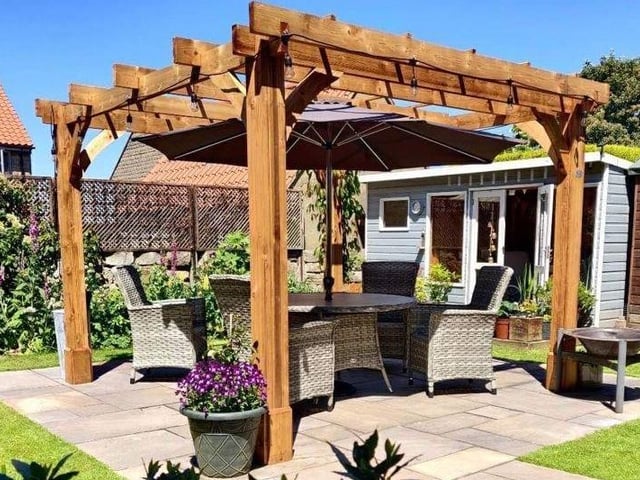 The property has a well maintained garden with an attractive pergola and paved area.