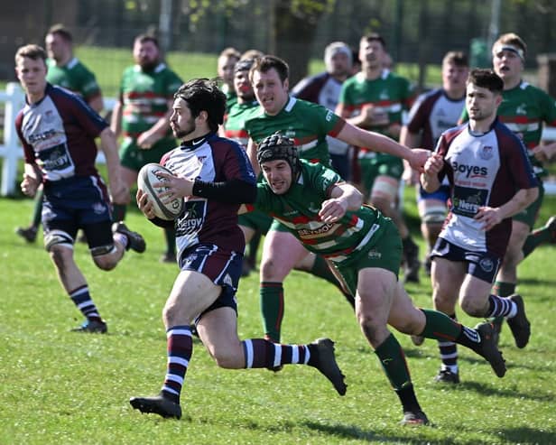 Scarborough's Joe Davies looks to outpace a West Hartlepool player. PHOTOS BY PAUL TAIT