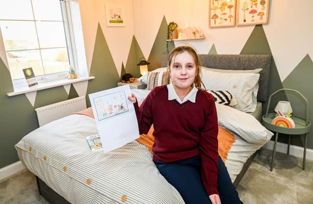 Here is Mia, a Bridlington student, showing off her winning designs in the show home bedroom. Photo courtesy of Barratt Homes Yorkshire East.