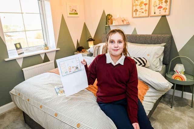 Here is Mia, a Bridlington student, showing off her winning designs in the show home bedroom. Photo courtesy of Barratt Homes Yorkshire East.