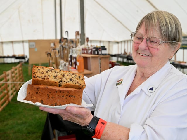 Judge Hazel Armstrong judging the fruit cake.