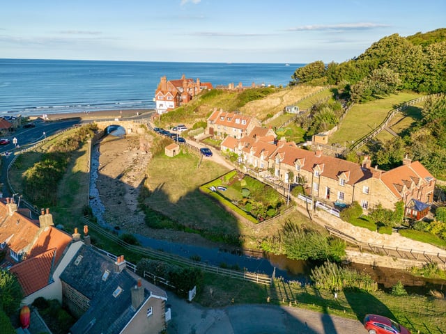 Overview of the cottages in their stunning fishing village location.