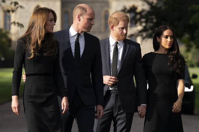Catherine, Princess of Wales, Prince William, Prince of Wales, Prince Harry, Duke of Sussex, and Meghan, Duchess of Sussex on the long Walk at Windsor Castle where crowds gathered and tributes left to Queen Elizabeth II, who died at Balmoral Castle last Thursday. (Photo by Kirsty O'Connor - WPA Pool/Getty Images)